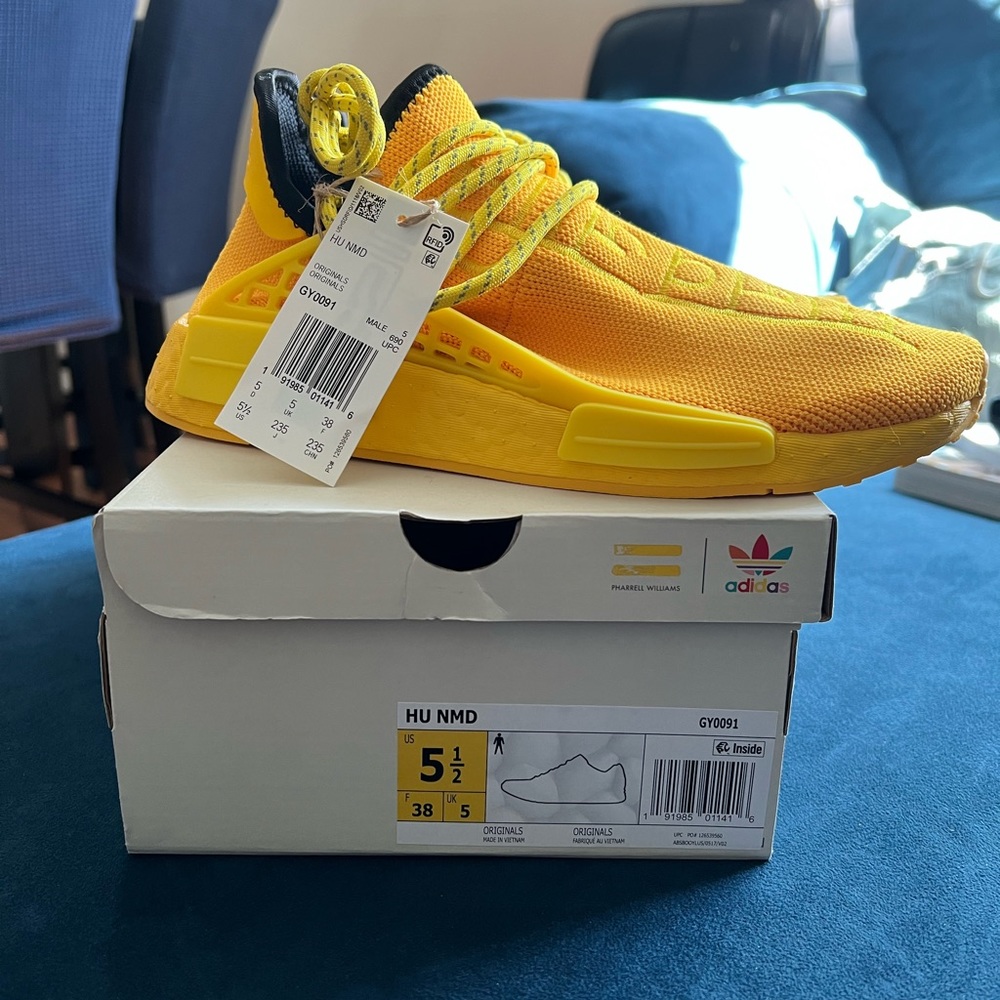 adidas
× Pharrell Hu NMD "Bold Gold/Yellow" sneakers. Size 5 1/2
